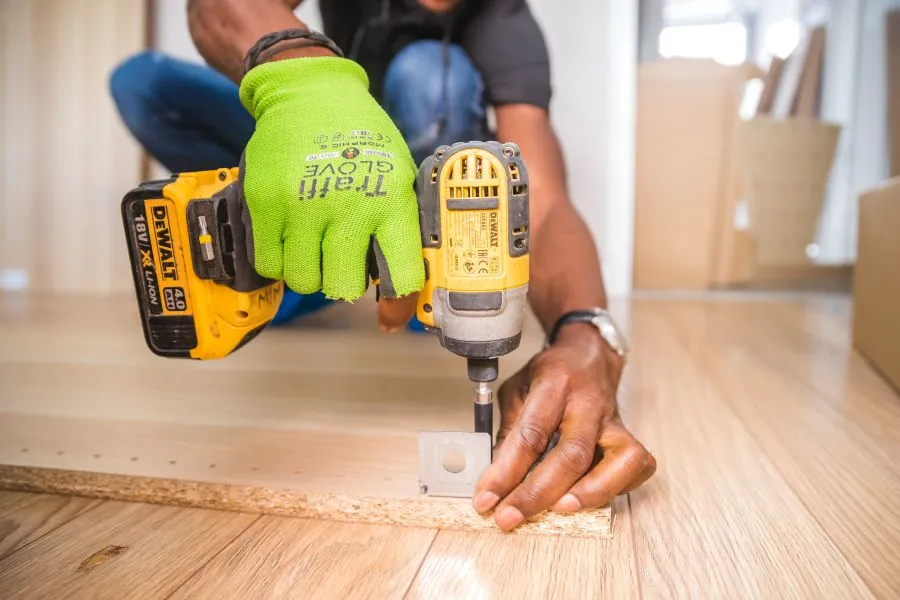 Drill fitted to a freshly laid timber floor during installation