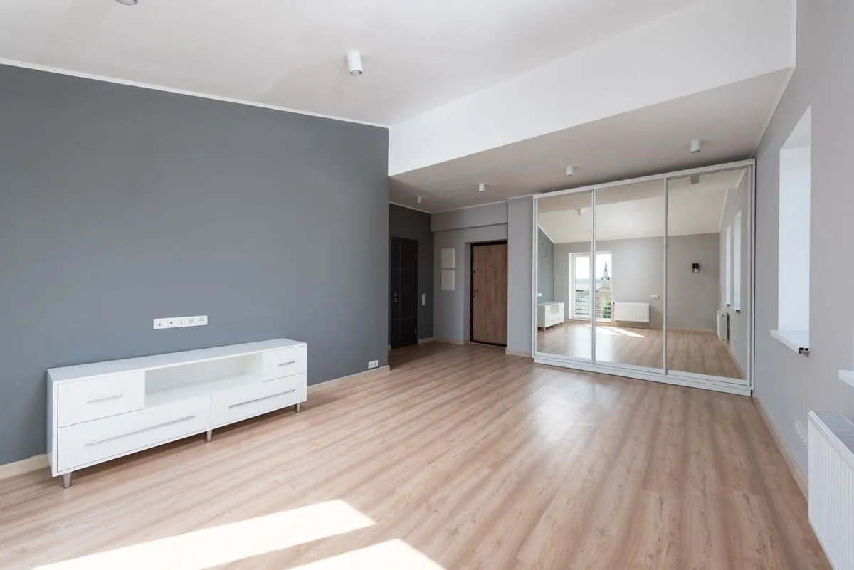 Bright living room with a light oak look floor