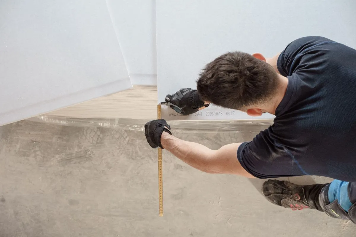 Measuring up a concrete slab before floor installation